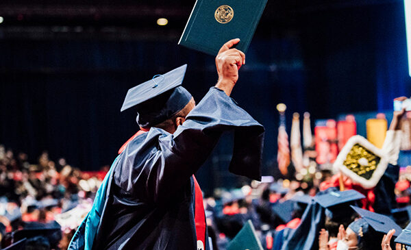 UIC student in graduation cap and gown