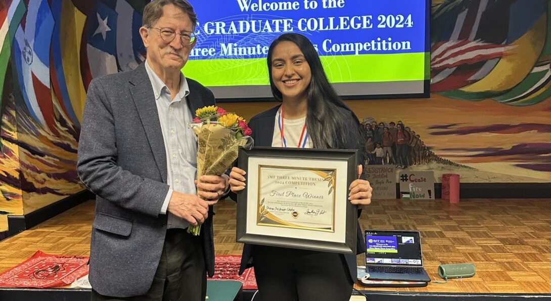 Aditi holding the 2024 3MT award certificate presented by the dean of the UIC Graduate College who stands next to her holding a bouquet of flowers