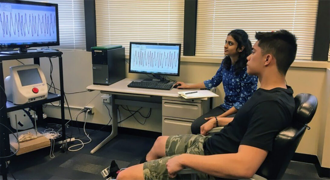 A woman and man looking at brain scans