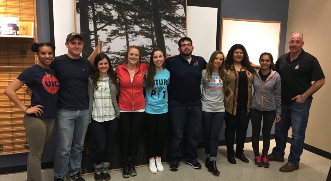 Eight UIC kinesiology students with professor John Coumbe-Lilley and program coordinator Kristina Jackson