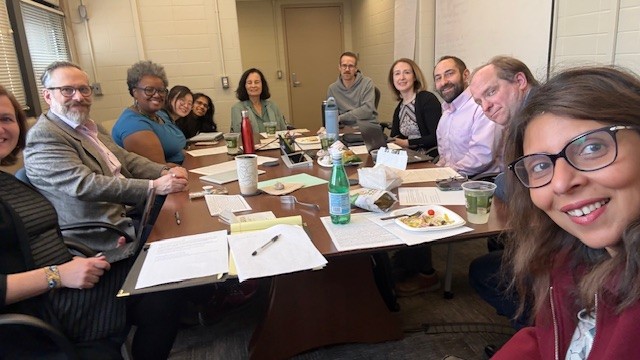 People sitting around a conference table discussion a proposal