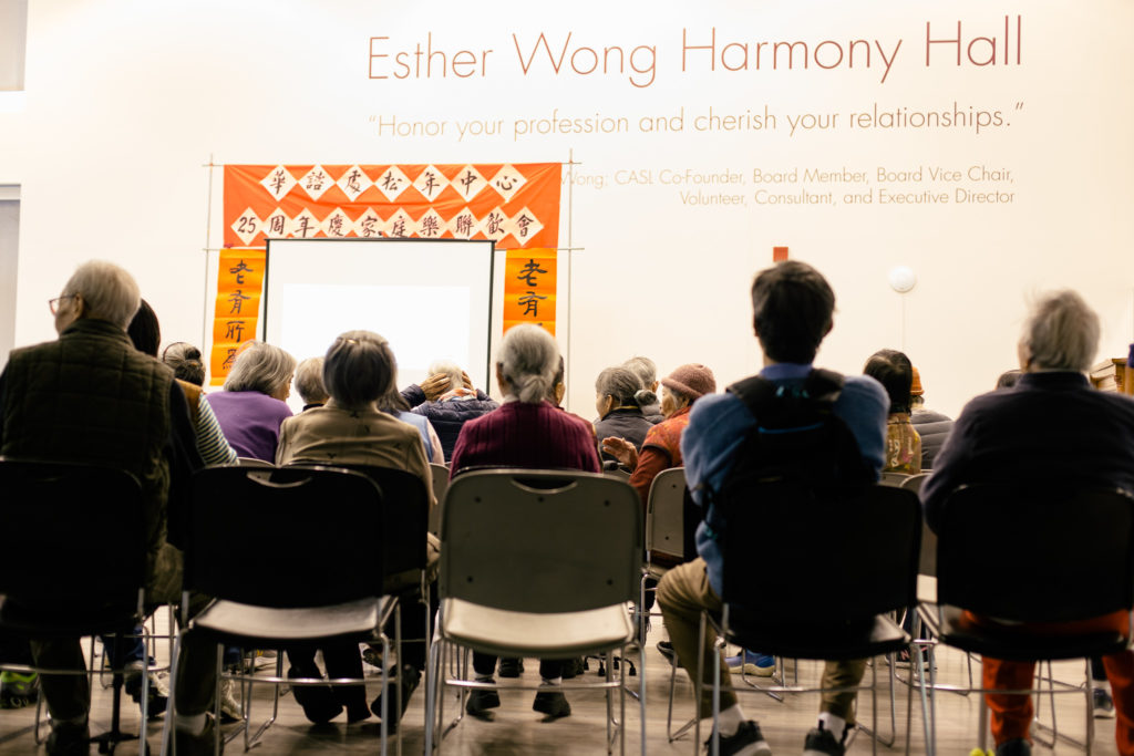 Photo of a group of elderly Asian Americans sitting in chairs