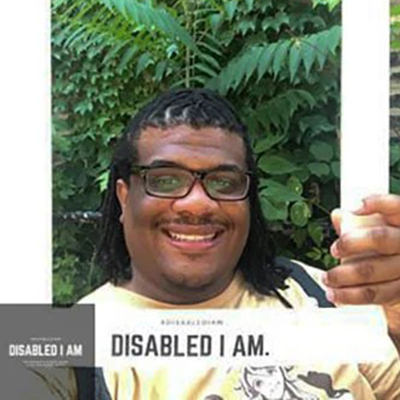 T.J. Gordon Jr. holds a #DisabledIAm frame