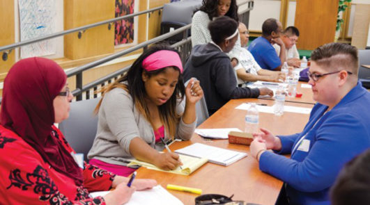 Three students sitting at a table