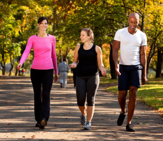 Three adults walking