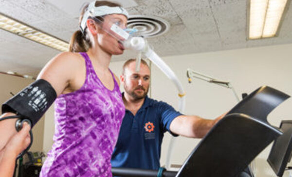 woman with breathing apparatus on treadmill