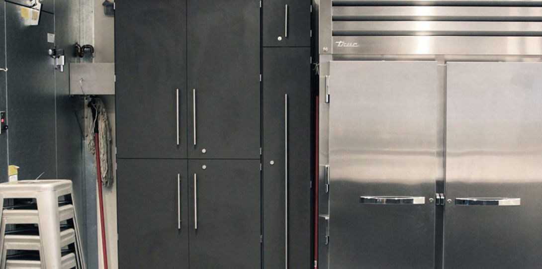 Black kitchen cabinets and refrigerator