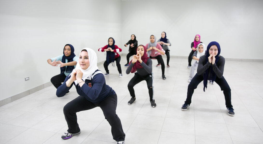 Rhonda Atallah leads a group of Muslim girls in a group exercise