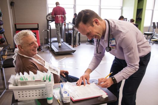 Cemal Ozemek with cardiac rehab patient