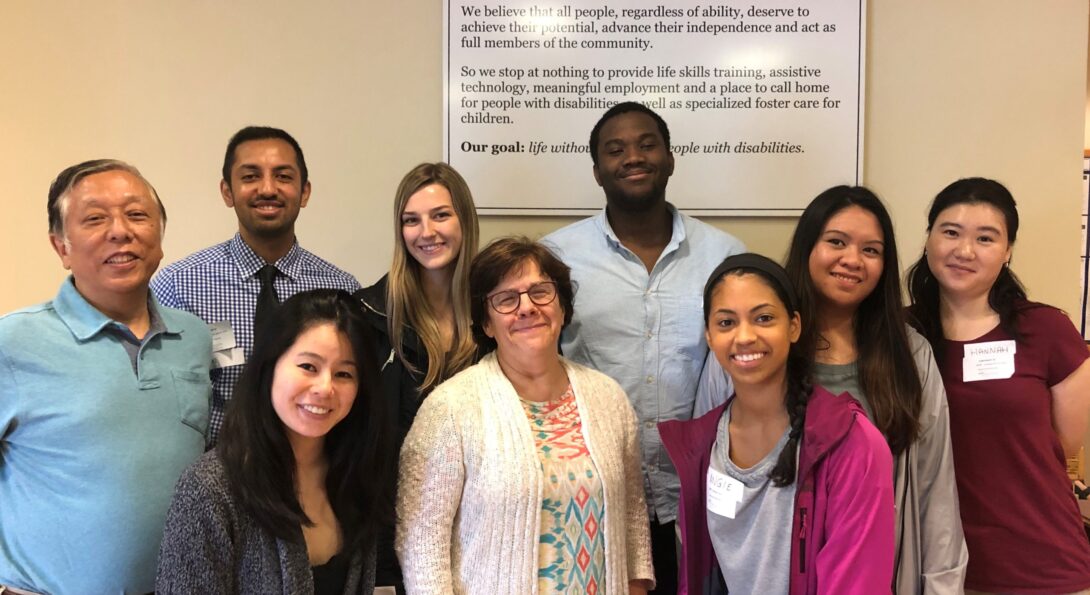 A group of UIC medical students in the DHD-family medicine program pose in the lobby of UCP Seguin with Maureen Gecht Silver (center, family medicine) and Kiyoshi Yamaki (left, DHD), who are in charge of the program.