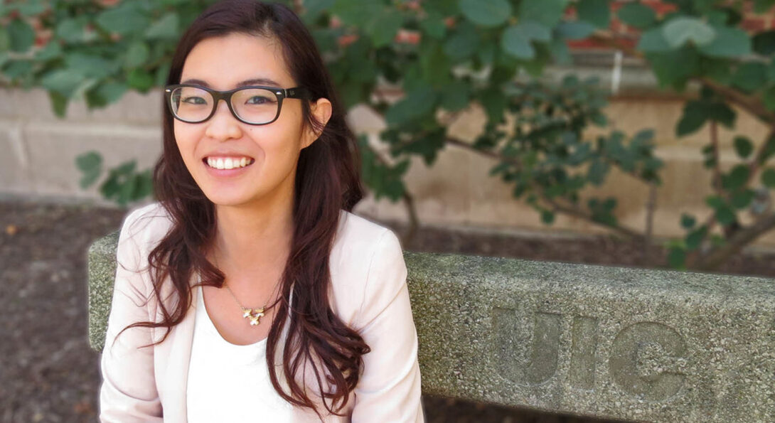 Esther Ng sitting on a bench outdoors