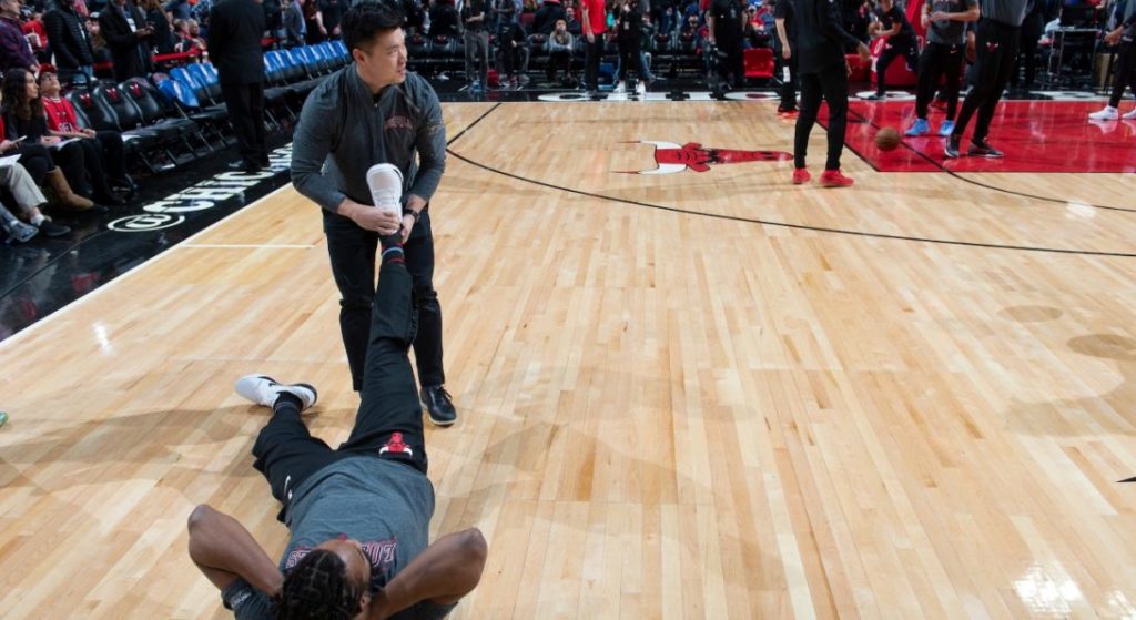 Arnold Lee with Chicago Bulls player Wayne Selden Jr.