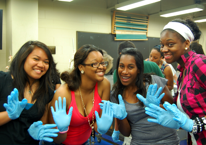 Group of students wearing blue gloves