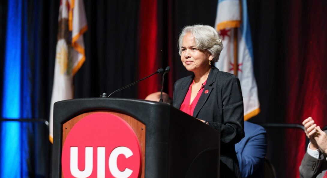 Marie Lynn Miranda stands behind a podium