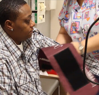 A UI Health Mile Square Health Center patient gets his blood pressure checked.
                  