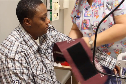 A UI Health Mile Square Health Center patient gets his blood pressure checked.