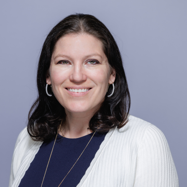 Headshot of women smiling at the camera.