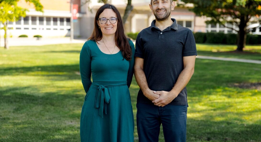 Delphine Labbé (left) and Yochai Eisenberg (right) stand outside of the DHSP building on UIC's west campus.