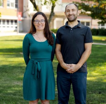 Delphine Labbé (left) and Yochai Eisenberg (right) stand outside of the DHSP building on UIC's west campus.
                  