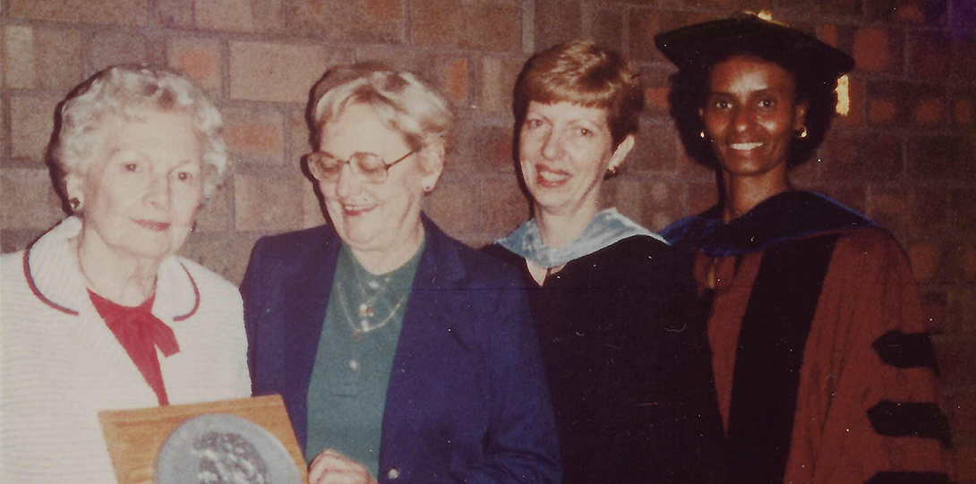 4 women smiling at the camera