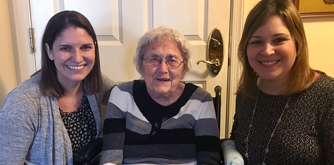 Three women smiling at the camera.