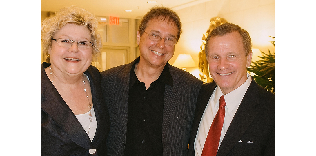 a group of people smiling at the camera