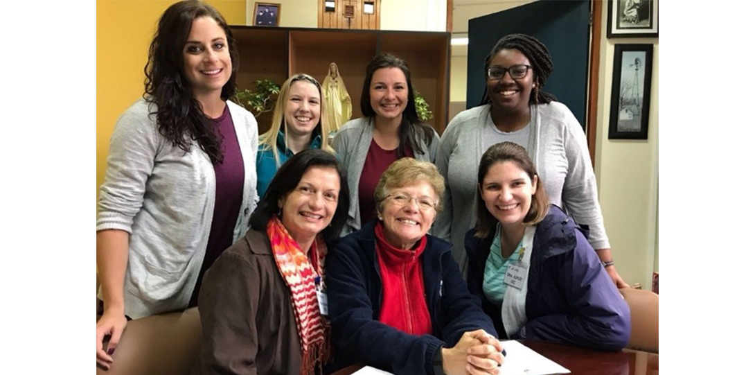 A group of people smiling at the camera