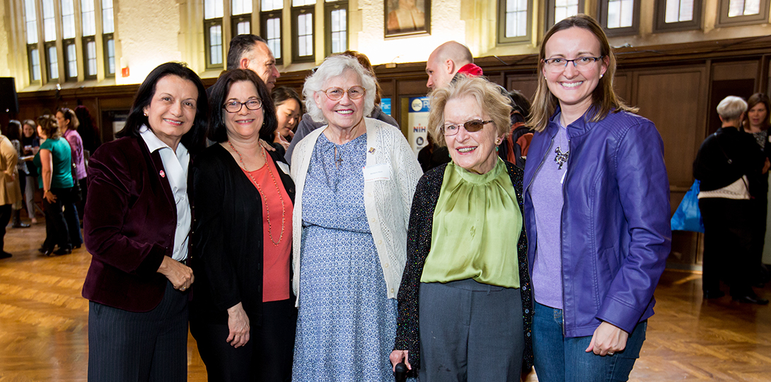 A group of women smiling at the camera.
