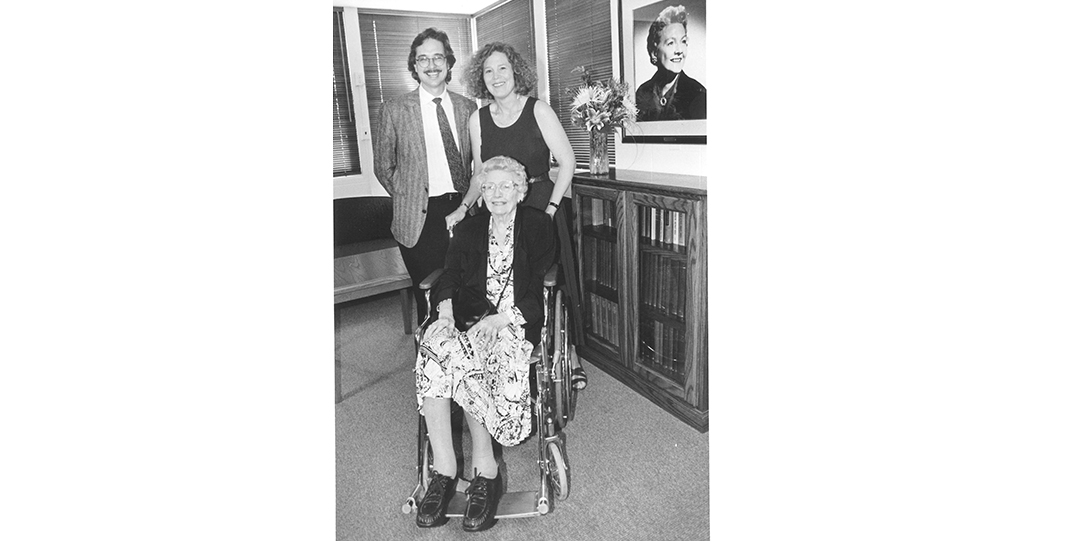 3 people smiling at the camera, black and white photo