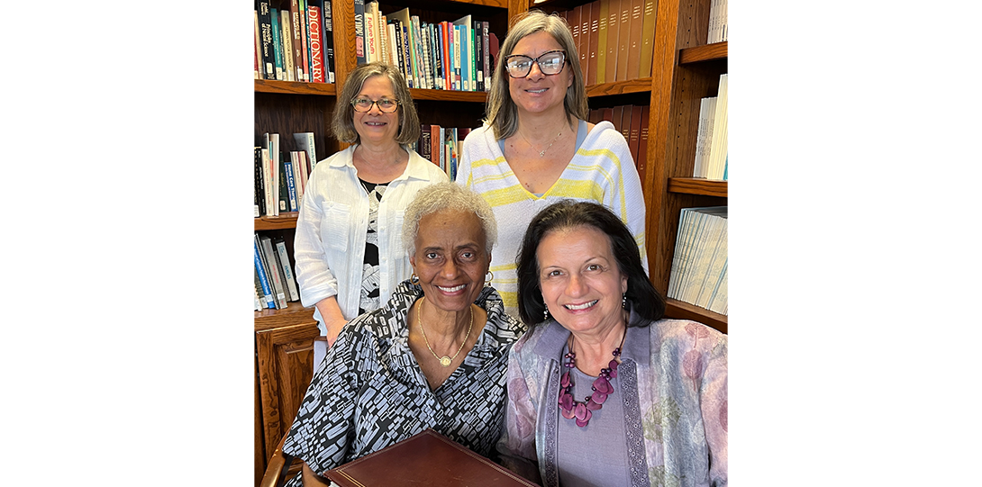 4 women smiling at the camera