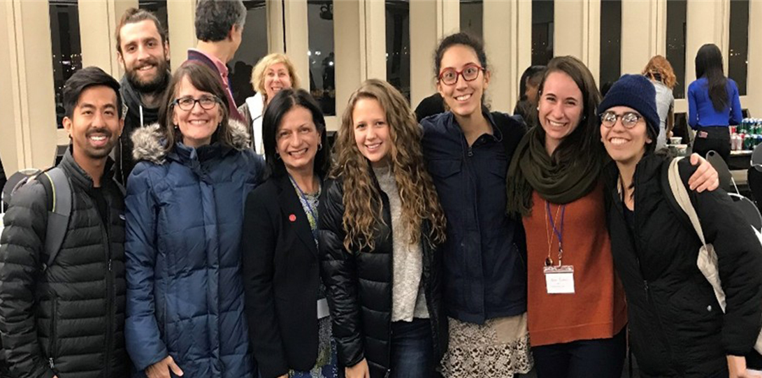 A group of people smiling at the camera.