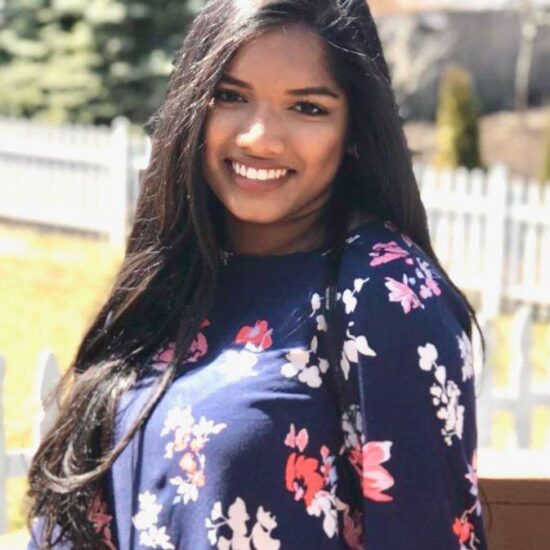 A woman smiling at the camera