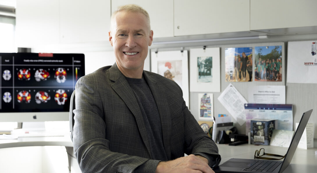 Robert Motl sitting behind a desk in his academic office